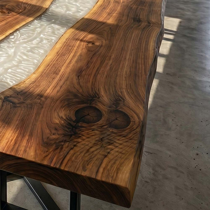 Wooden table with a natural grain pattern on a concrete floor.