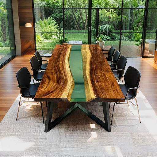 Modern epoxy river table with a serene green resin river, crafted from live edge natural wood slabs for a perfect blend of nature and contemporary style.