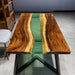 Modern epoxy river table with a serene green resin river, crafted from live edge natural wood slabs for a perfect blend of nature and contemporary style.