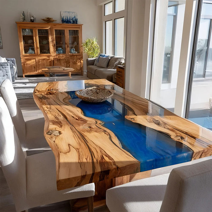 Dining room with a unique wooden table featuring a blue resin inlay.