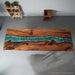 Custom river epoxy dinning table showcasing rich walnut wood grain