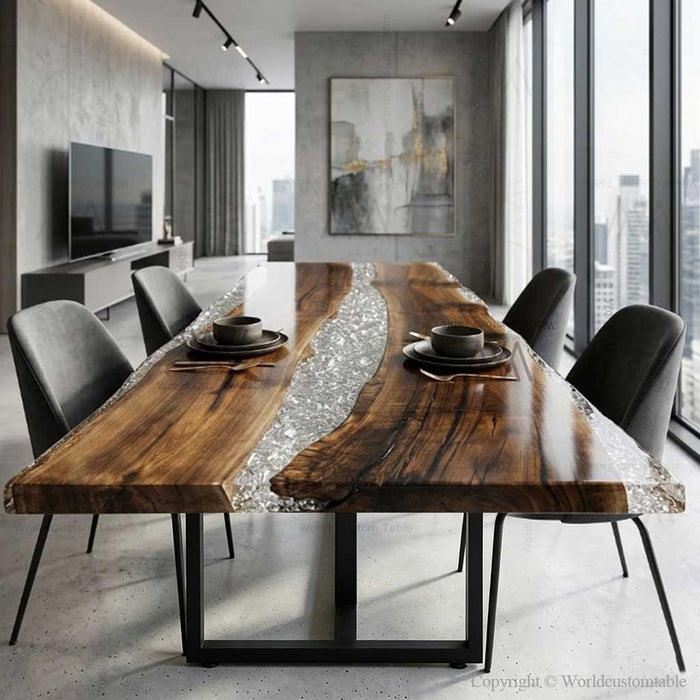 Bespoke walnut and clear resin dining table in a bright, modern interior setting.