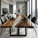 Bespoke walnut and clear resin dining table in a bright, modern interior setting.