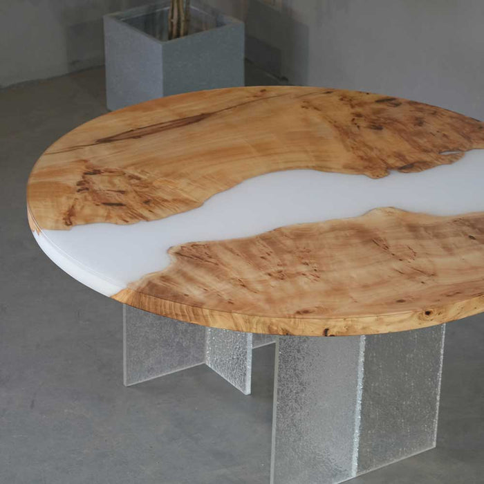 Custom round resin dining table perfect for modern and minimalist interiors.