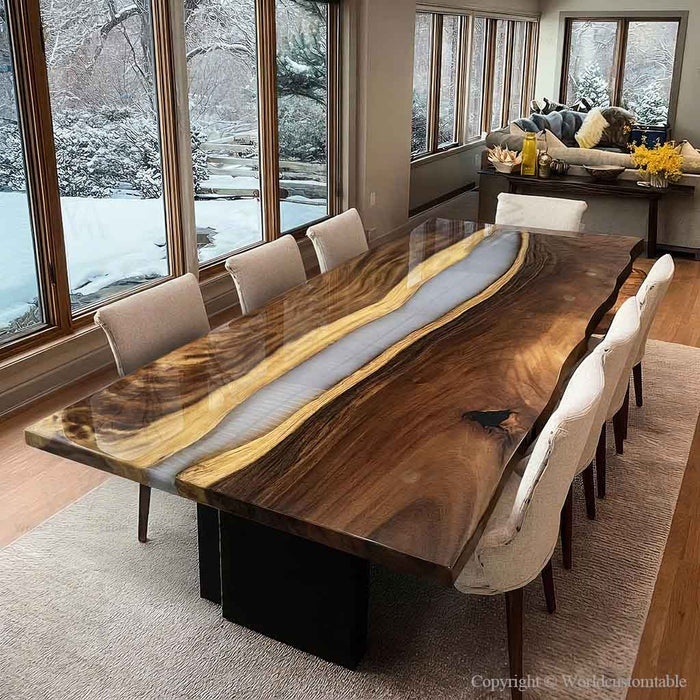 Dining room with a large wooden table and chairs, featuring a snowy outdoor view.