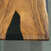 Compact live edge island with natural bark, ideal for big kitchens.