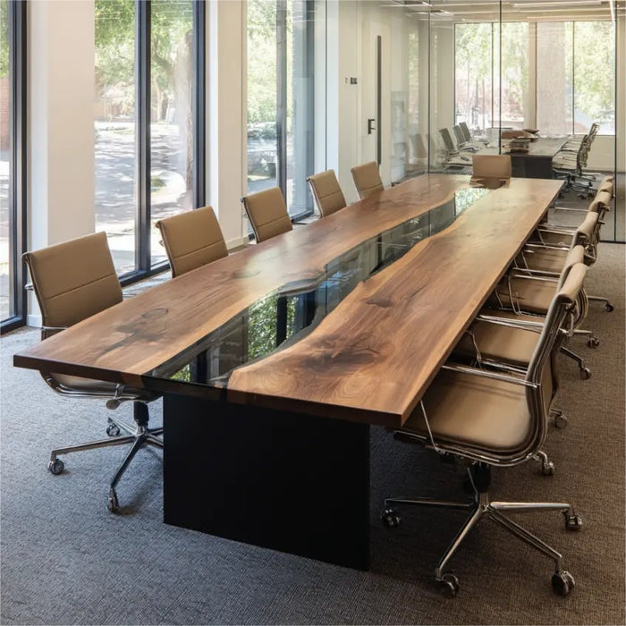 Long wooden conference table with chairs in a modern office setting