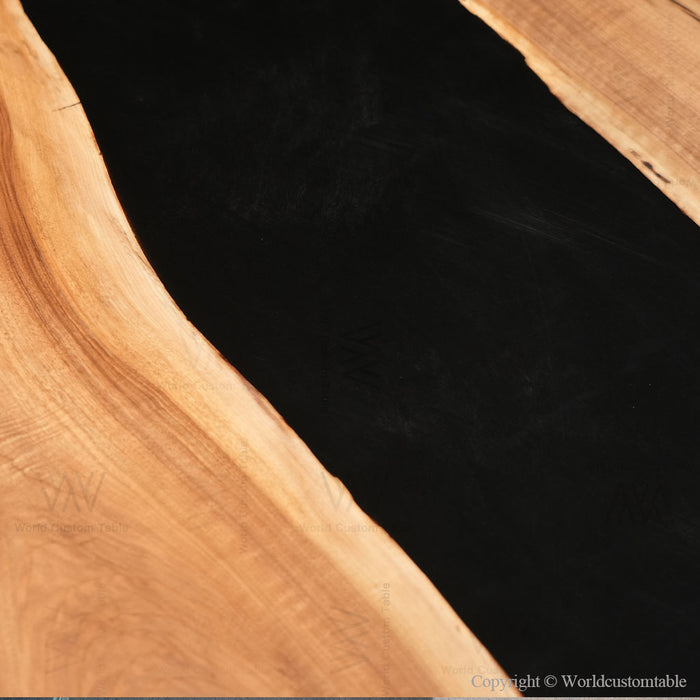 Custom walnut epoxy dining table black resin in industrial loft setting