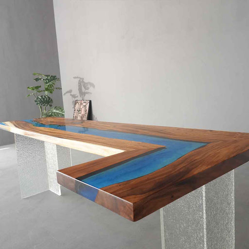 Custom L-shaped epoxy resin kitchen countertop featuring walnut wood and mysterious blue resin