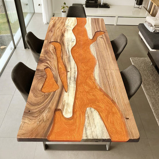 Custom walnut epoxy river table with vivid orange resin and natural wood grain