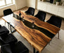 Modern walnut epoxy resin dining table with natural live edge design