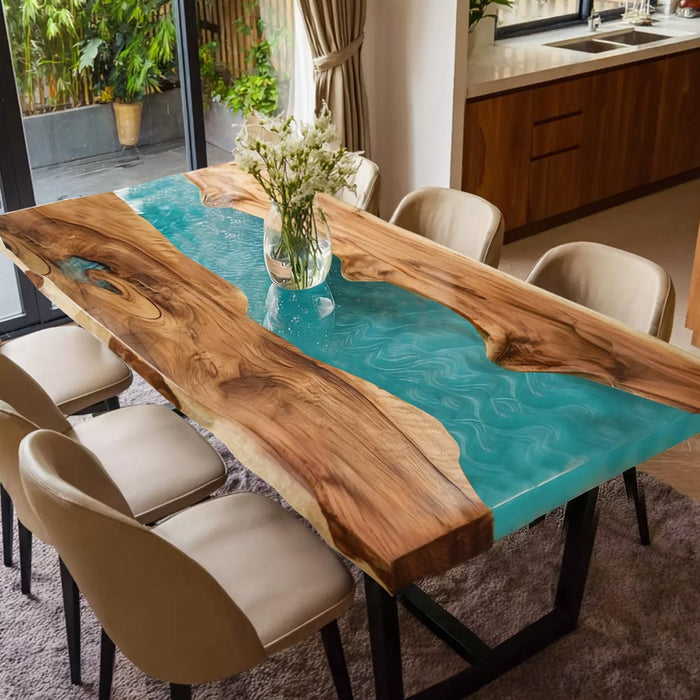 Custom walnut dining table featuring a turquoise resin river with flowing patterns.
