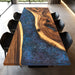 Custom walnut dining table featuring a stunning starry sky epoxy resin design.