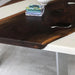 Custom white epoxy dining table with wood accents, perfect for luxury home dining areas.