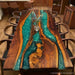 Modern custom wood and resin dining table for elegant interior spaces.