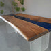 Modern custom wood and resin table ideal for office and meeting spaces.