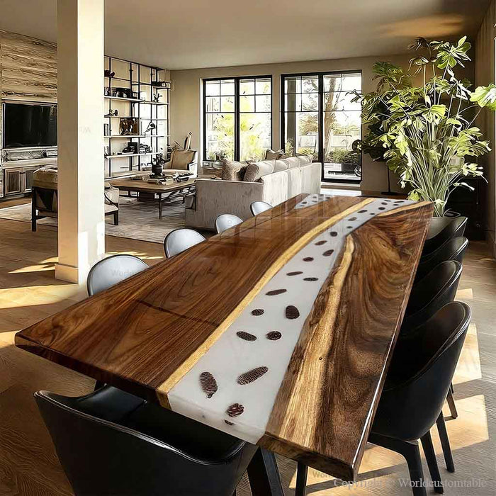 Close up detail of pine cones inside a custom woodland epoxy river table.