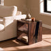 Black walnut epoxy sofa table with two shelves positioned behind a sofa in a modern living room