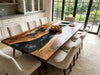Dark mood black walnut dining table with swirled black epoxy resin river, minimalist open-concept dining room furniture