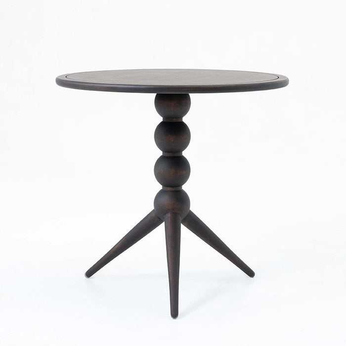 Decorative side table with vintage-modern style, featuring unique black legs and a walnut finish top.