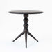 Decorative side table with vintage-modern style, featuring unique black legs and a walnut finish top.