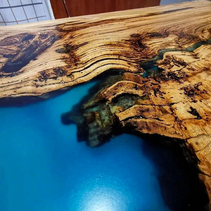 Wooden surface with blue resin filling the cracks
