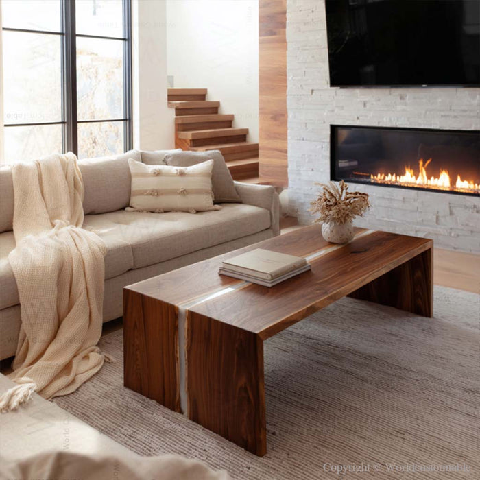 Designer white resin and walnut epoxy coffee table in contemporary living space
