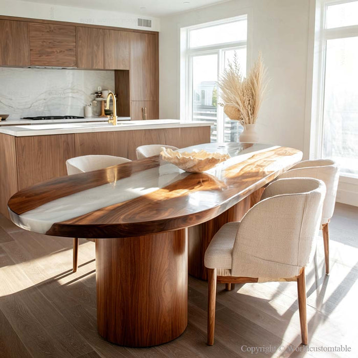 Elegant oval resin river table made of black walnut styled in a sophisticated interior setting