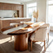 Elegant oval resin river table made of black walnut styled in a sophisticated interior setting