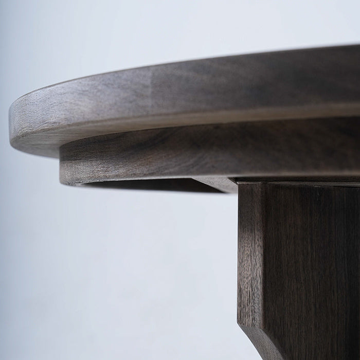 Elegant Terminalia coffee table with round top and interlocking wood legs