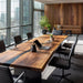 Modern office conference room with wooden table and chairs, large windows, and a cityscape view.