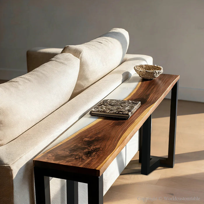 Elegant white epoxy river side table next to a sofa in bright natural light