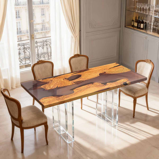 Dining table with unique design in a room with large windows and a gray wall.