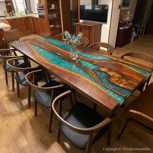 Solid walnut slab table with polished emerald epoxy river finish.