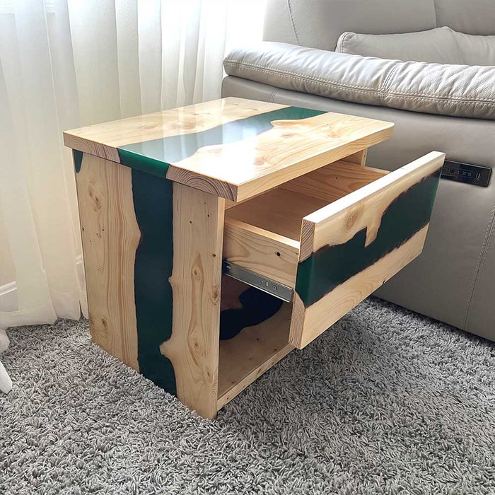 Epoxy bedside table combining ash wood and black resin.