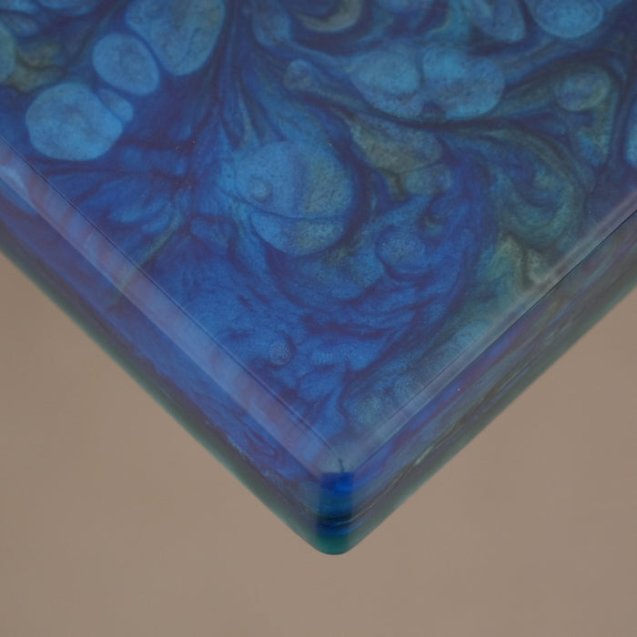 Handcrafted dining table with green resin and olivewood slab