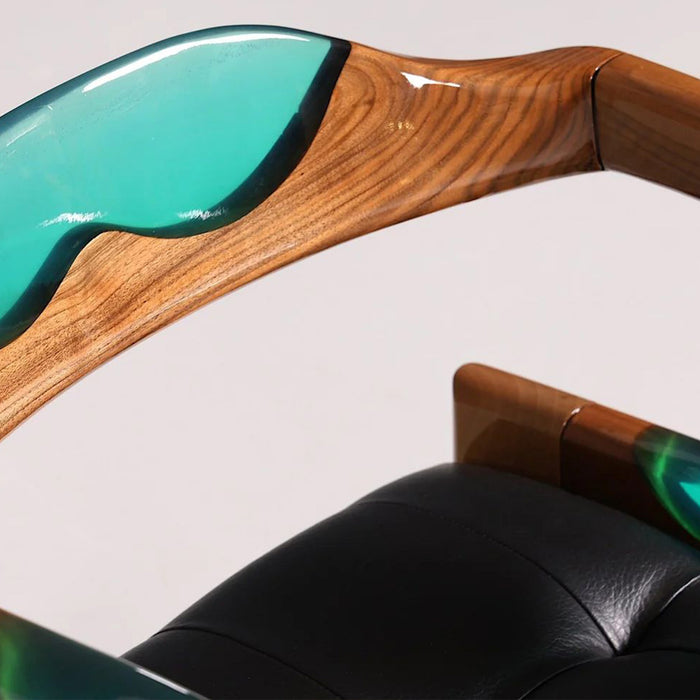 Close-up of a modern chair with wooden and green resin design on a white background