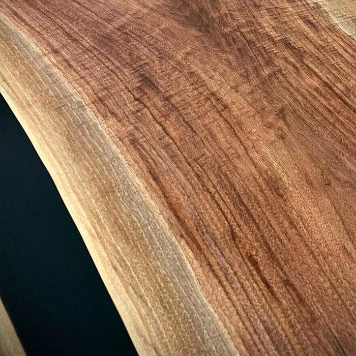 Stylish round epoxy resin and walnut table styled in living room