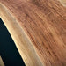 Stylish round epoxy resin and walnut table styled in living room