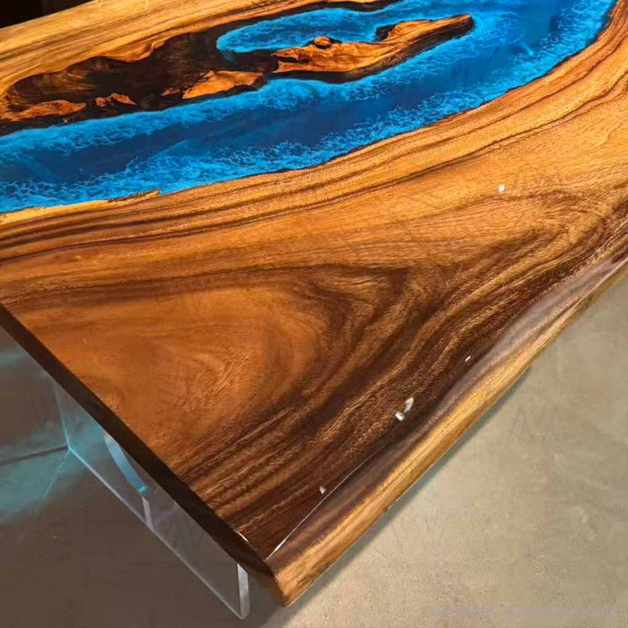 Epoxy resin and wood coffee table with California modern style and vibrant blue inlay.