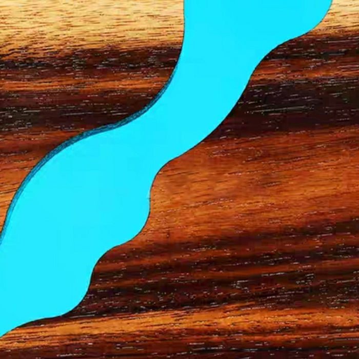 Close-up of a wooden surface with a blue river-like design