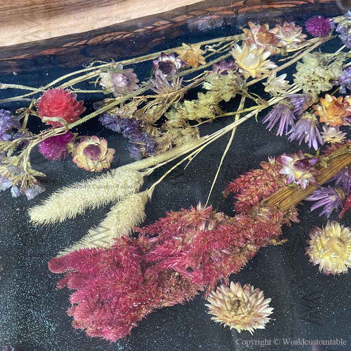 Epoxy river walnut dining table with botanical details commonly styled in Texas homes.