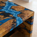 Interior view highlighting epoxy waterfall burl wood table as centerpiece