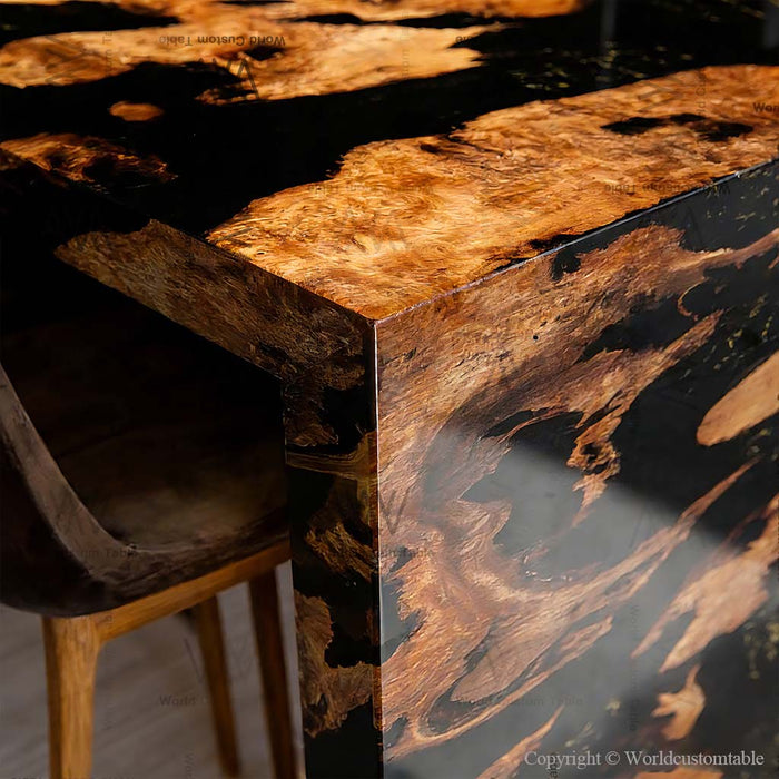 Natural burl wood texture on a handcrafted epoxy waterfall table