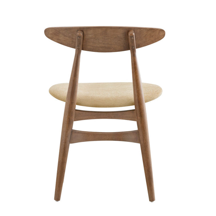 Wooden chair with beige cushion on a white background