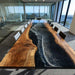 Extra large black walnut epoxy river table front view showcasing black ocean wave resin