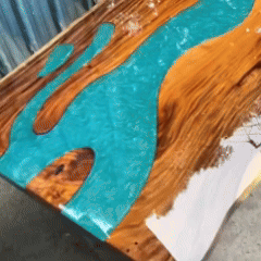 Extra-long live edge walnut dining table with resin