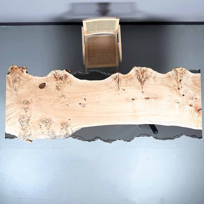 Wooden table with a natural, rustic finish on a plain background