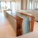 Glossy aqua resin waterfall table in modern home interior