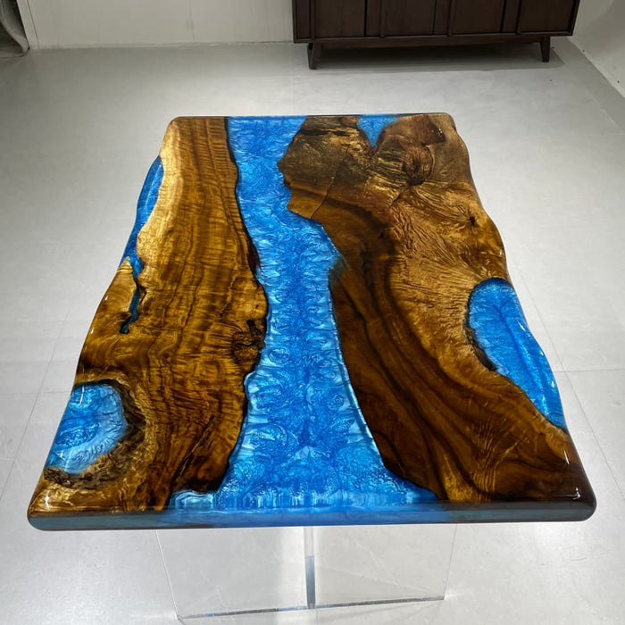 golden camphor wood coffee table featuring blue epoxy
